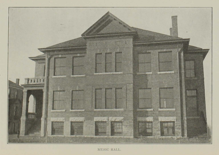 Three-story brick building captured in black and white. The caption "Music Hall" beneath it.