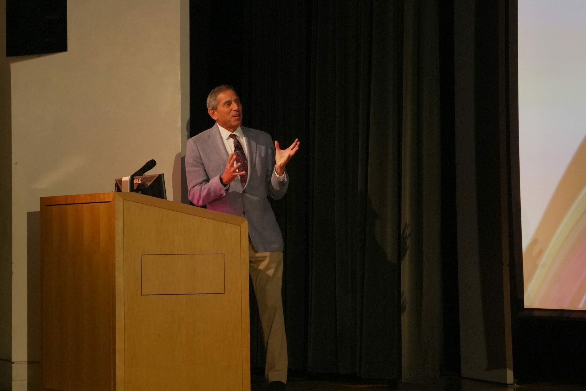Man stands at podium